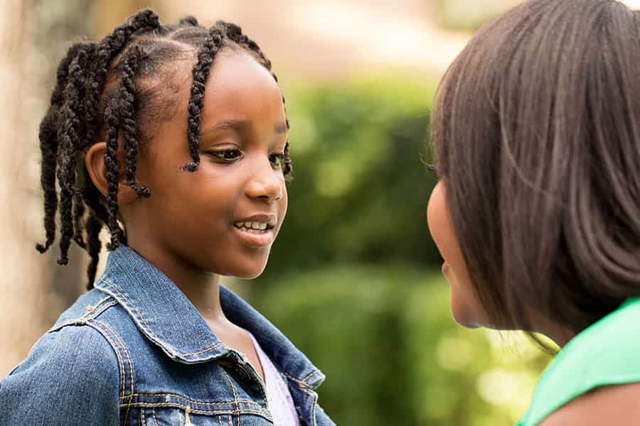 A parent talking to her daughter